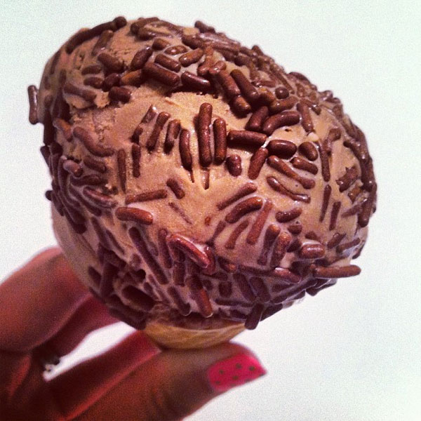 chocolate ice cream cone with chocolate sprinkles