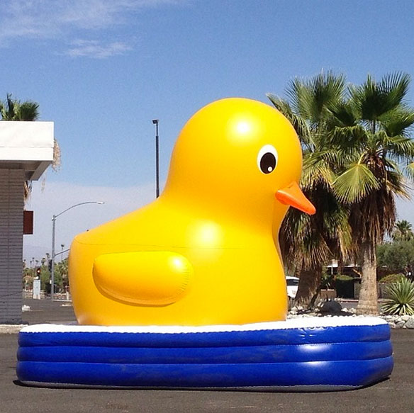 photo by kelly golightly; giant duck pool float palm springs kool pool khool pool giant inflatable duck giant duck pool float