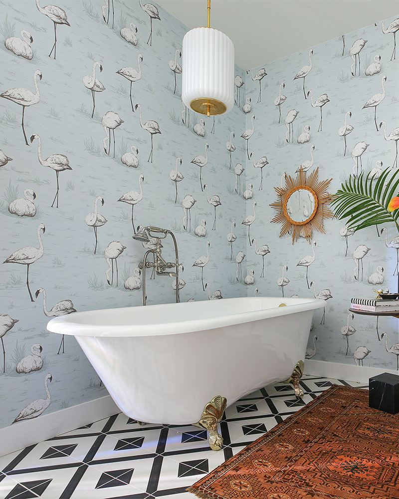 Kelly Golightly's Bathroom designed by Dee Murphy for The Christopher Kennedy Compound Modernism Week Show House in Palm Springs: Flamingo wallpaper, AlysEdwards black & white tile, Victoria & Albery freestanding tub = major glamour. #bathroomdesign #bathroomgoals