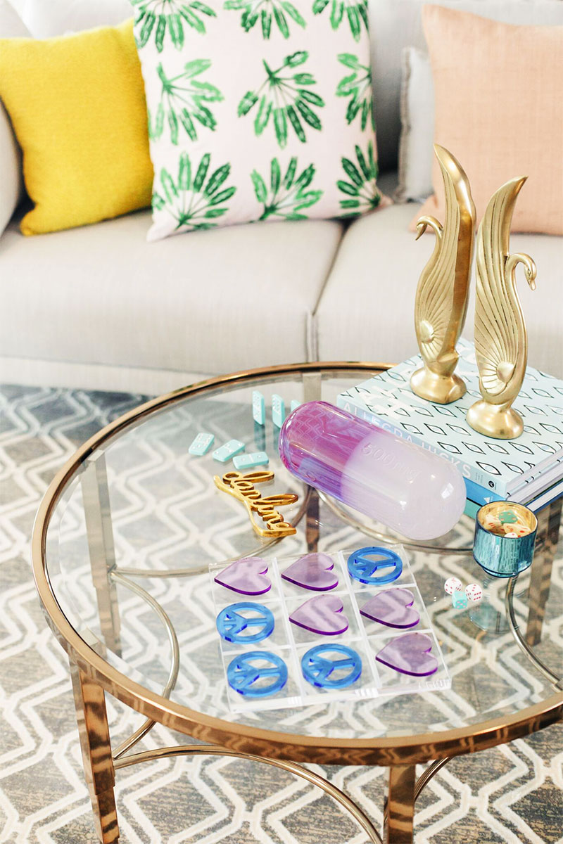 Kelly Golightly's Colorful Family Room: See the Before & After + How To Style a Coffee Table! #palmspringsstyle #palmsprings #interiordesign #howtostyleacoffeetable #jonathanadler #themine #shopthemine