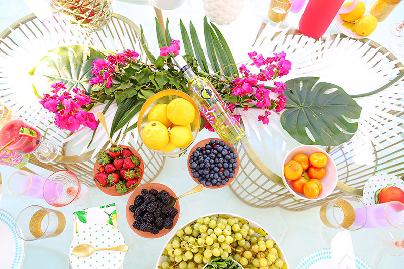 Love this palm leaf decor and using fruit as decoration!
