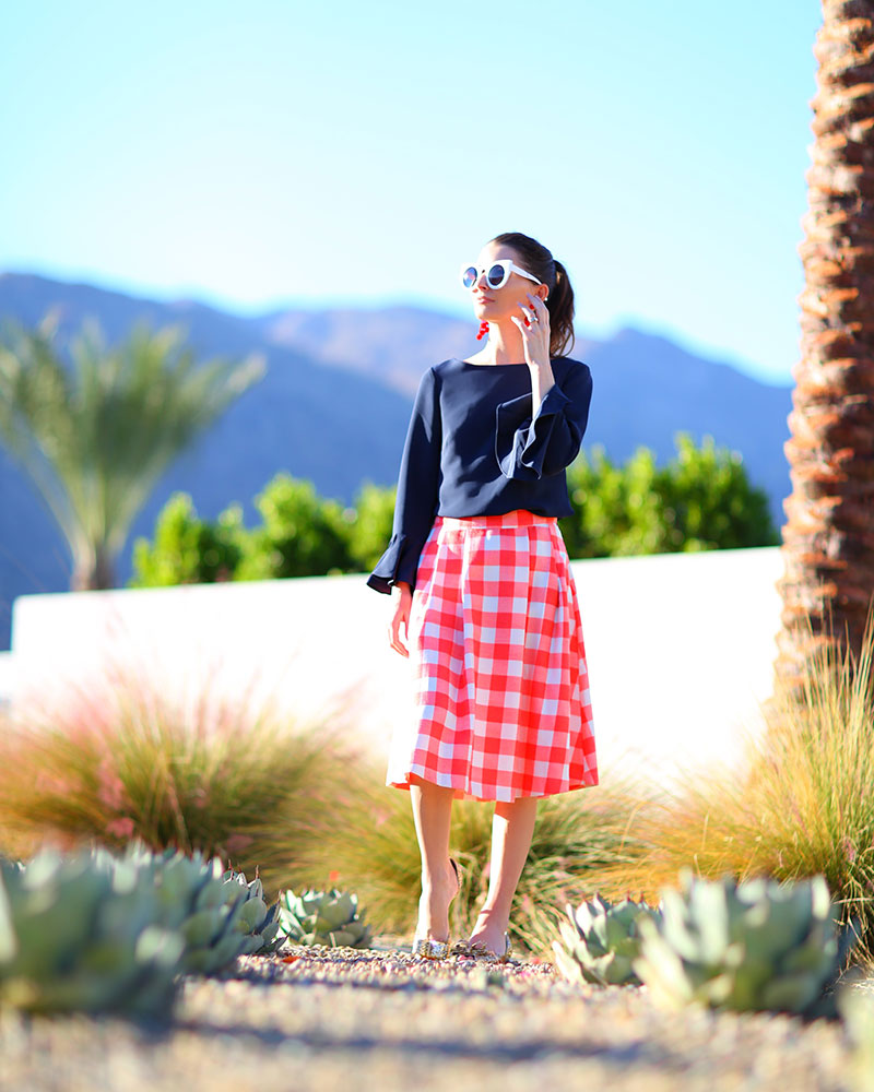 Cute bell sleeve top on fashion blogger Kelly Golightly in Palm Springs. 