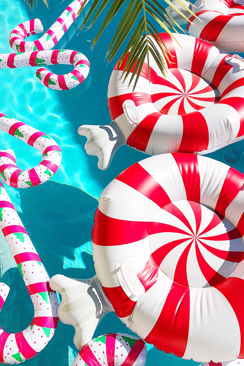 Peppermint pool floats, reindeer pool floats, and candy cane pool floats on a pool Christmas Decor in Palm Springs