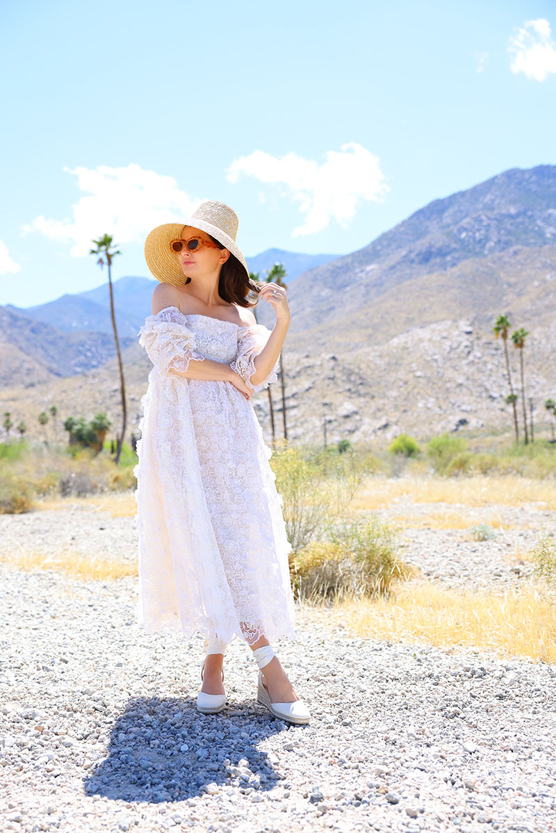 Kelly Golightly wears a Romantic white floral lace dress by Eddy in the Palm Springs desert.