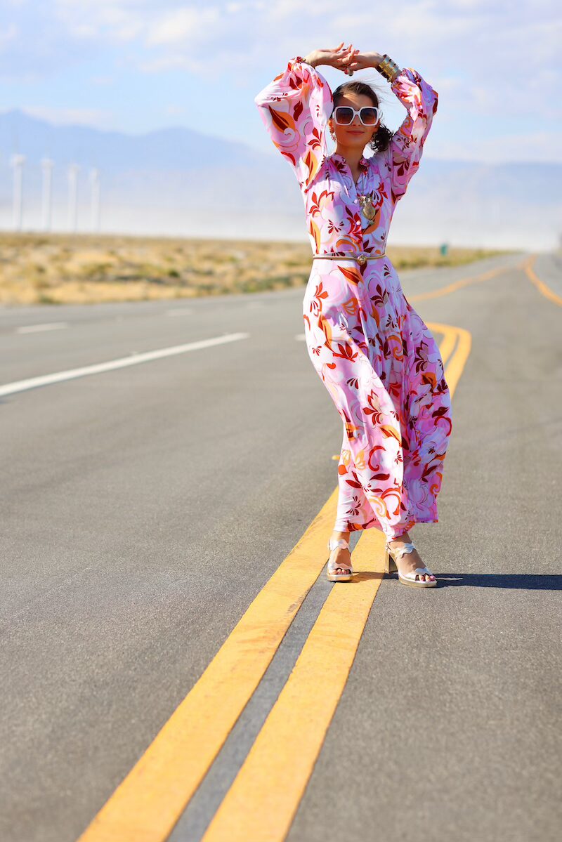 Kelly Golightly wearing a vintage-inspired caftan from her debut collection, photographed in sunny Palm Springs — designed for glamorous days, poolside brunches, and star-lit soirées.